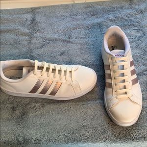 Rose gold and white Adidas shoes